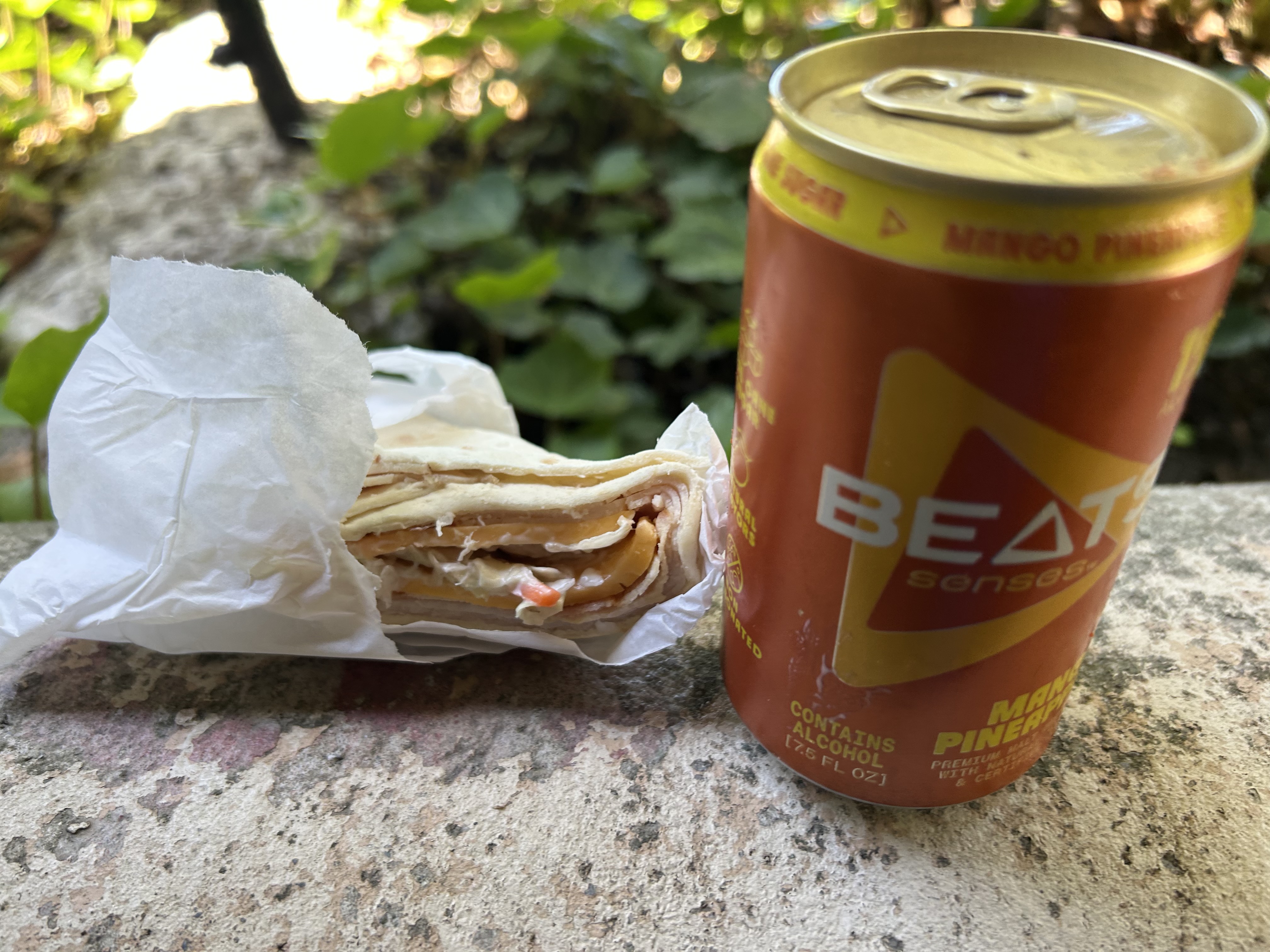 Before — wrap and BEATS energy drink on a ledge at Lucky's