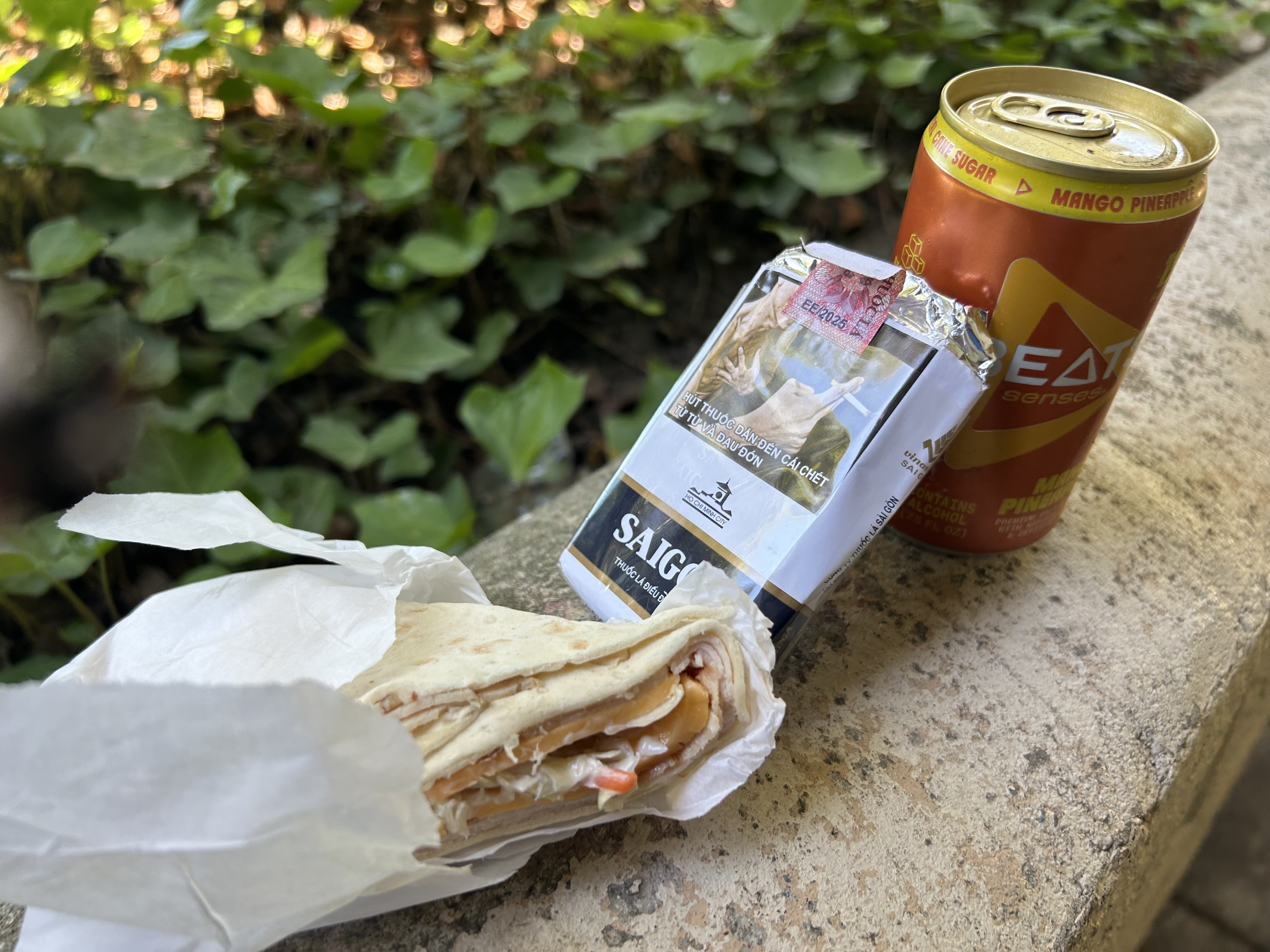 Wrap, BEATS, and Saigon cigarettes on a ledge — pre-McDonald's