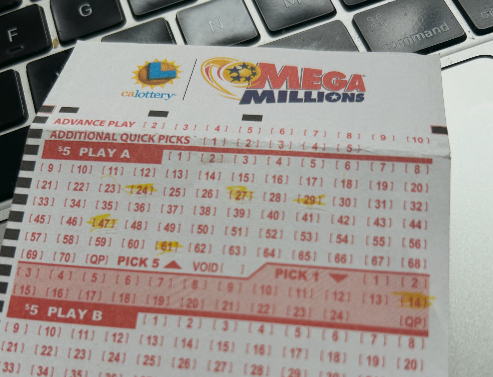 Mega Millions ticket — number 14 circled