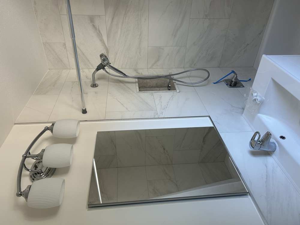 Completed bathroom — Artisan Tile Co., April 2026