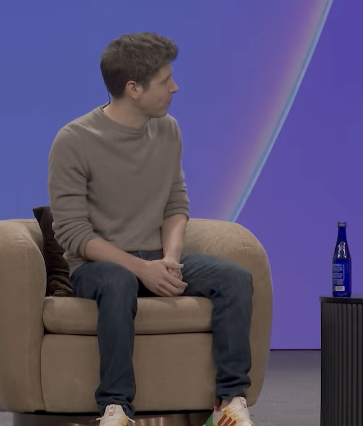 Sam Altman at Stripe Sessions — the edge, the hands, the posture